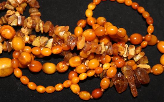 Three assorted amber necklaces, gross weight 108 grams.